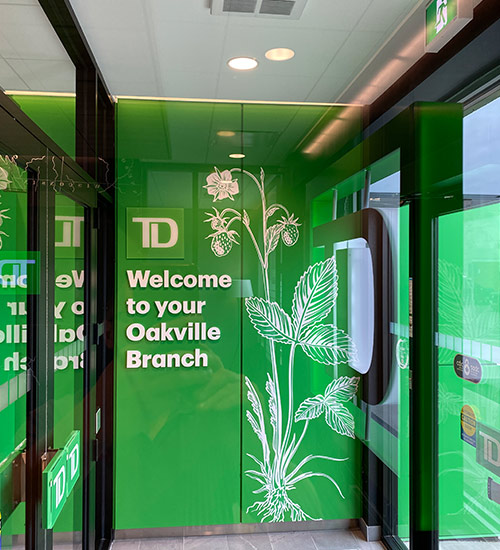 Entrance tape-mounted logo, letters and vinyl graphics installation